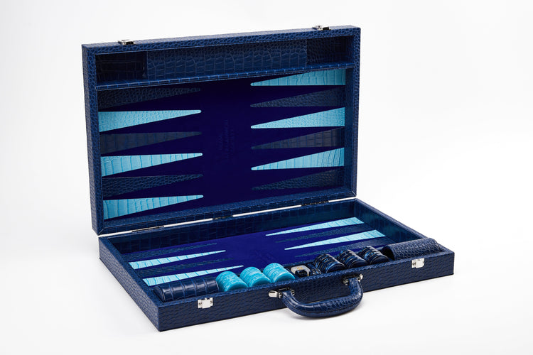 Straight-on view of open Midnight Navy crocodile-embossed backgammon case standing upright with checkers stacked in the side tray