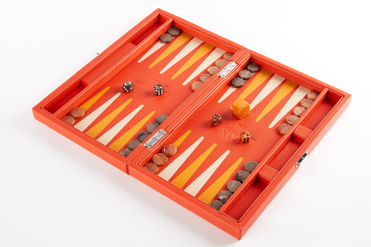 Orange backgammon board open flat at an angle, fully set up