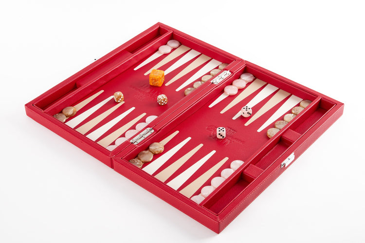 Red backgammon board open flat at an angle, fully set up