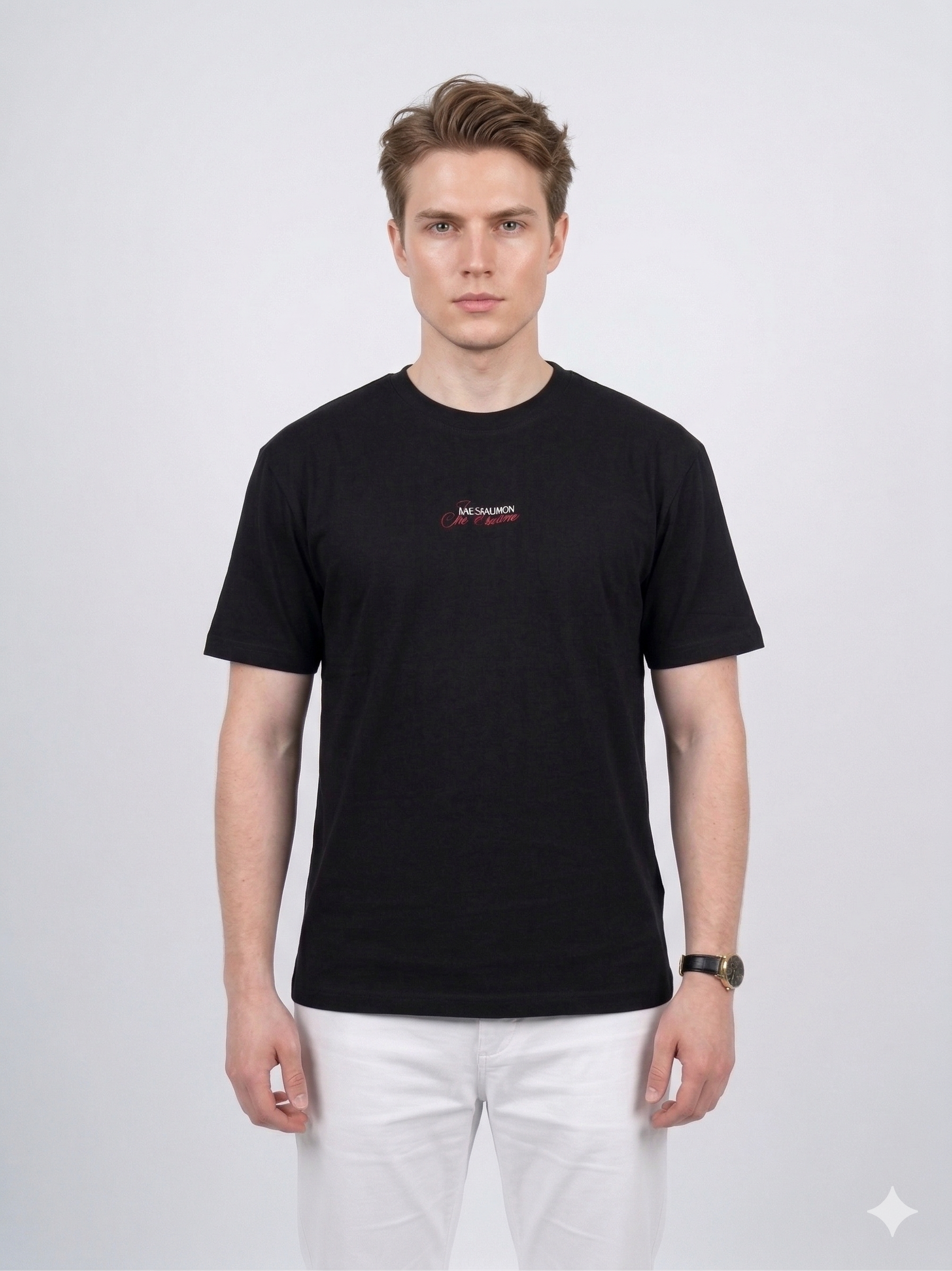 Model wearing the black Backgammon Je t'aime T-shirt with embroidered red script logo on the chest