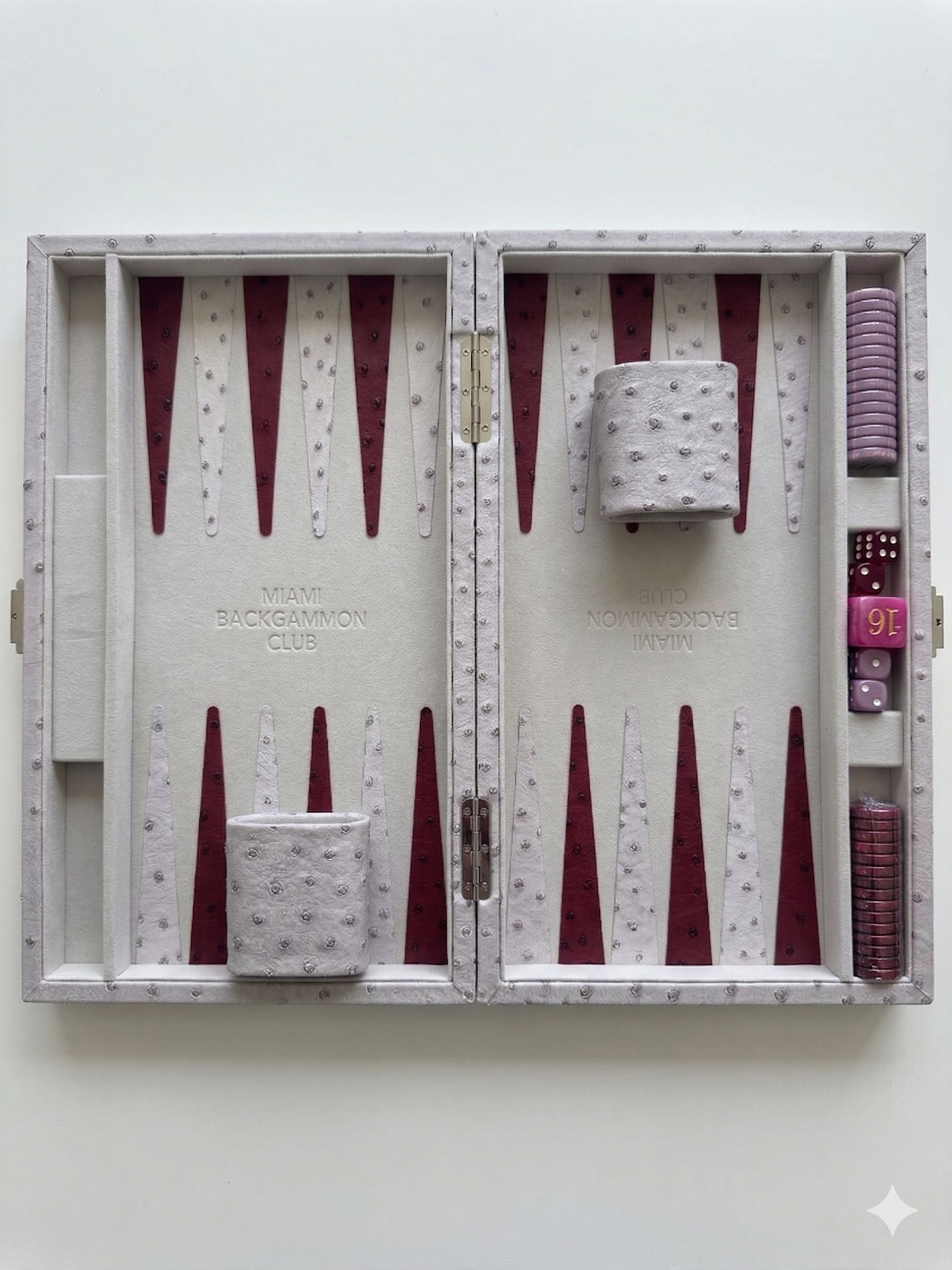 Overhead flat-lay view of the open Lavender Mini Miami Backgammon Board with cream and burgundy playing field, dice cups, checkers, and doubling cube
