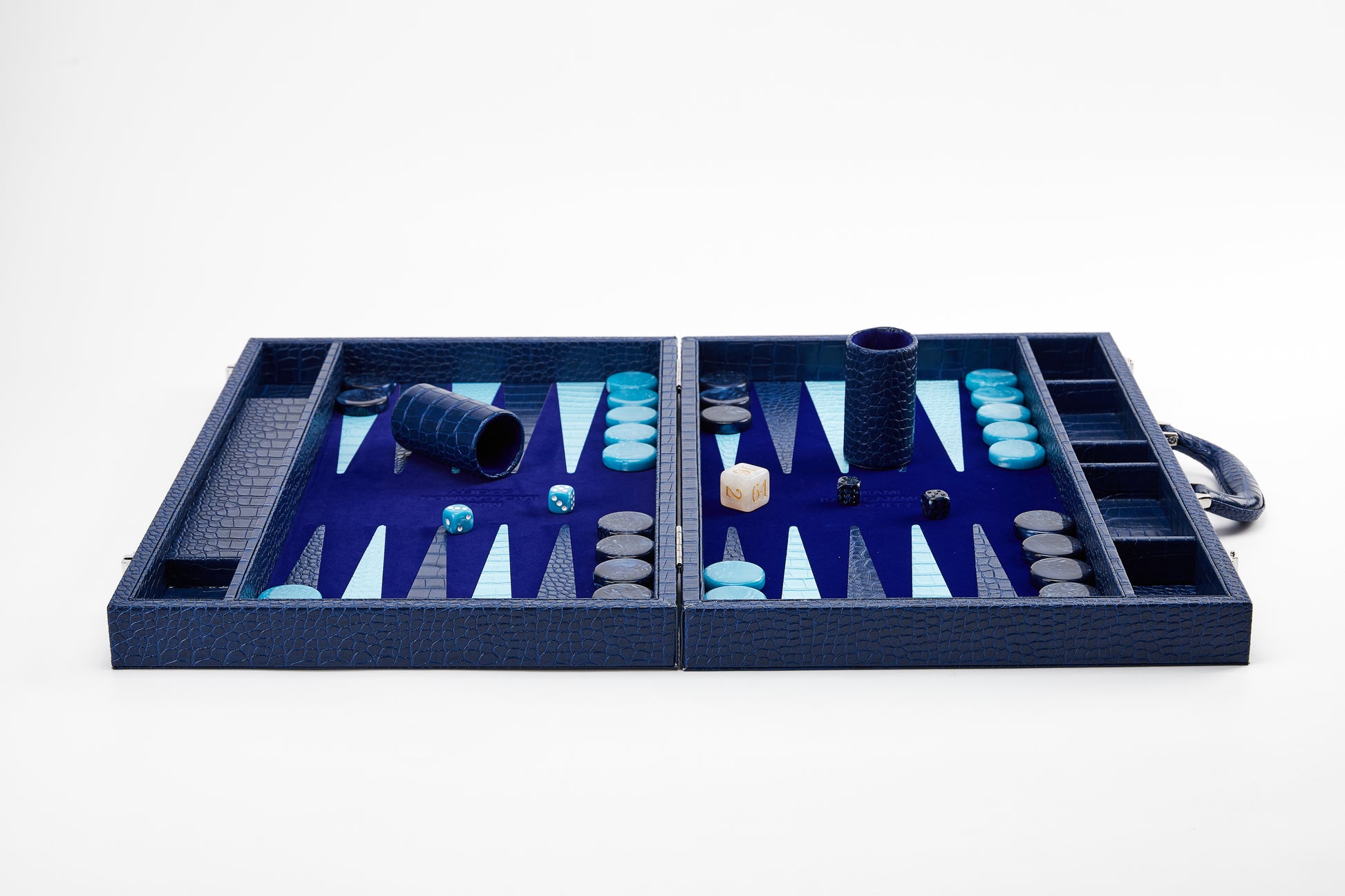 Full front view of the open Midnight Navy backgammon board with dice cups, dice, and checkers set up on both playing fields