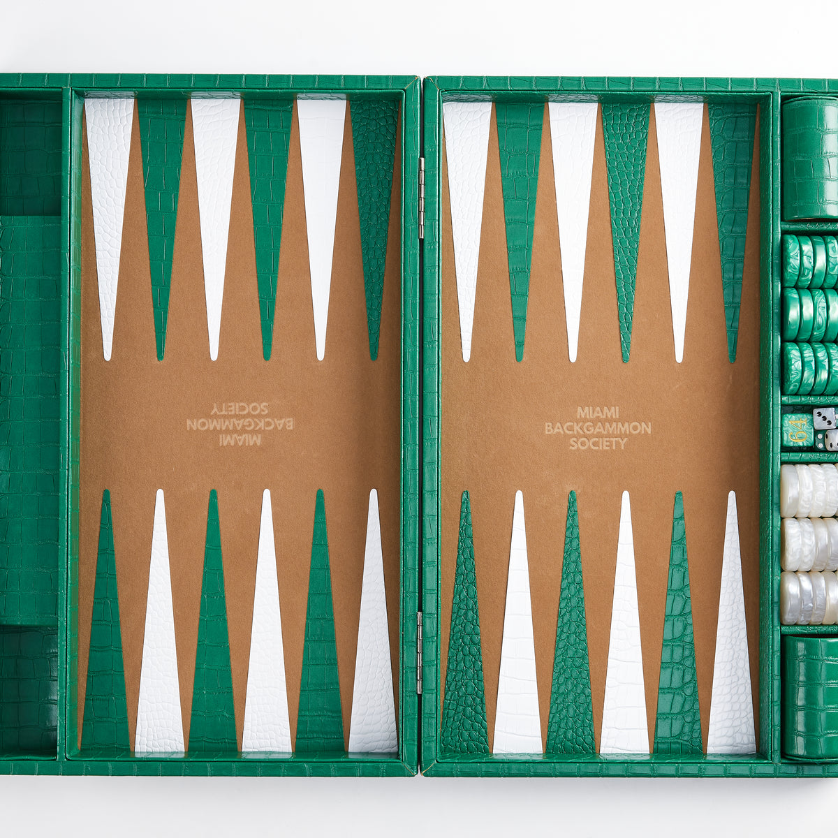 Top-down view of empty emerald green and white backgammon playing surface with checkers stacked on the side