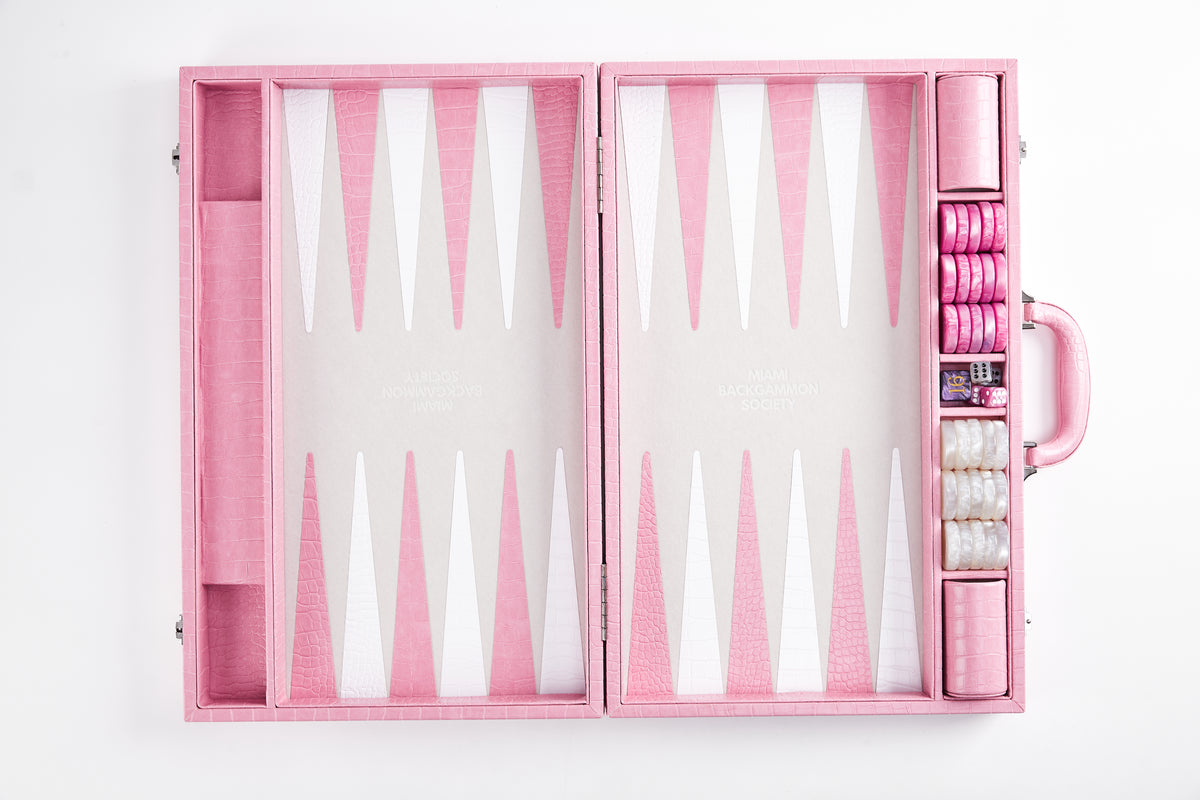 Straight-on view of open Miami Pink crocodile-embossed backgammon case standing upright with pink and white checkers in the side tray