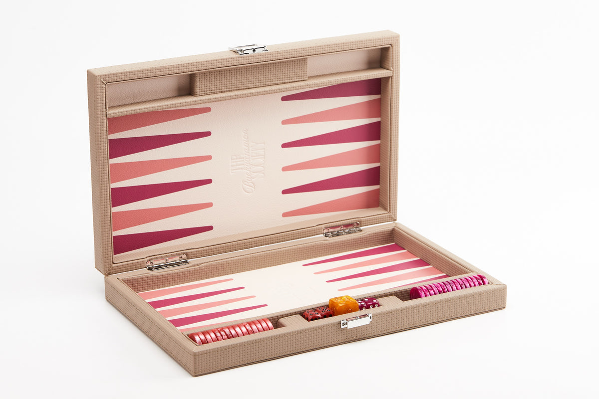 Beige backgammon board open at an angle, showing pink and magenta points