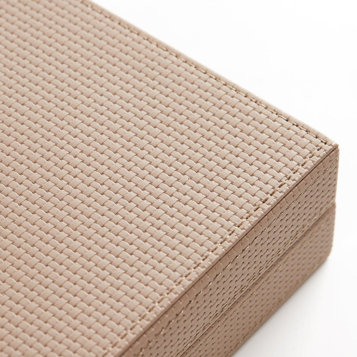 Close-up of the woven texture of the sand leather case