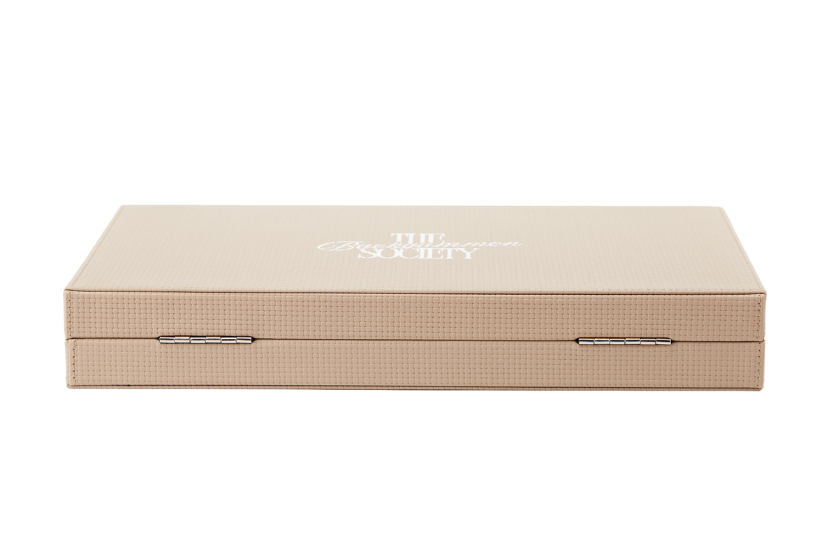 The Backgammon Society Board in beige, open, cut out on a transparent background