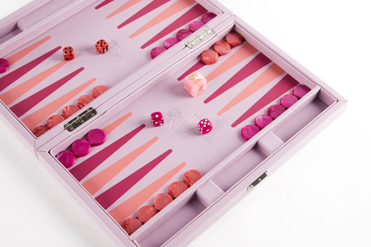 Pink backgammon board set up for play with checkers, dice and doubling cube