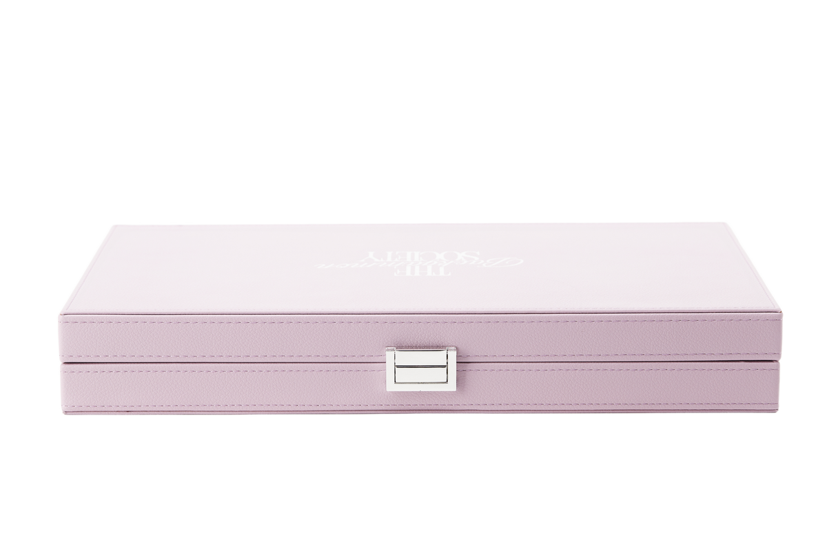 The Backgammon Society Board in blush pink, closed, cut out on a transparent background