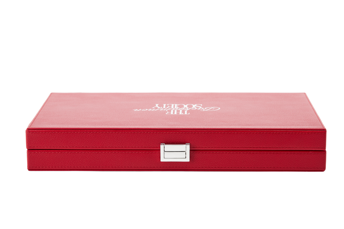 The Backgammon Society Board in red, closed, cut out on a transparent background